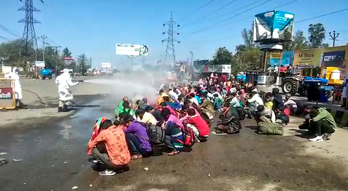 Migrants were sprayed with a bleach solution before they were allowed to enter the town of Bareilly in Uttar Pradesh. A video of the incident triggered allegations of class bias and led to nationwide outrage.