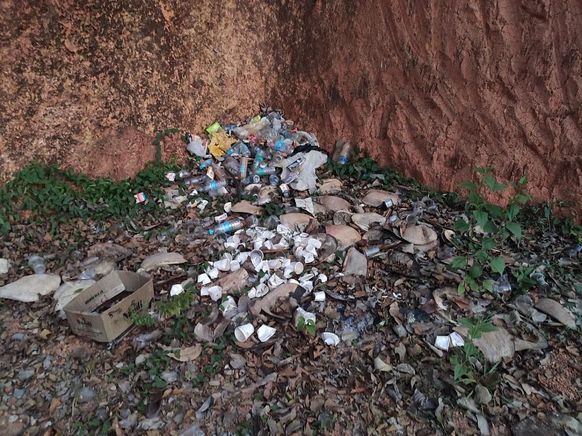 Trash littered near the bank of River Kapila.