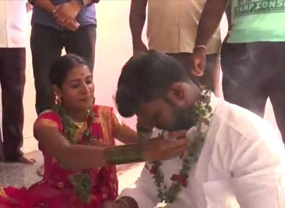 Usha and Arvind during their wedding at a temple in Punajanuru.