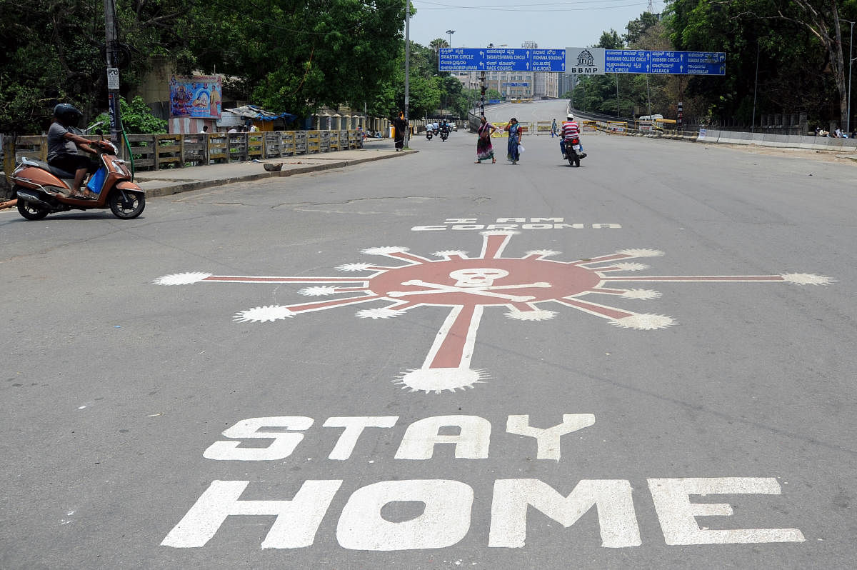 Coronavirus awareness painting on the road near Anand Rao circle flyover, Bengaluru, on Thursday. DH Photo/ Pushkar V