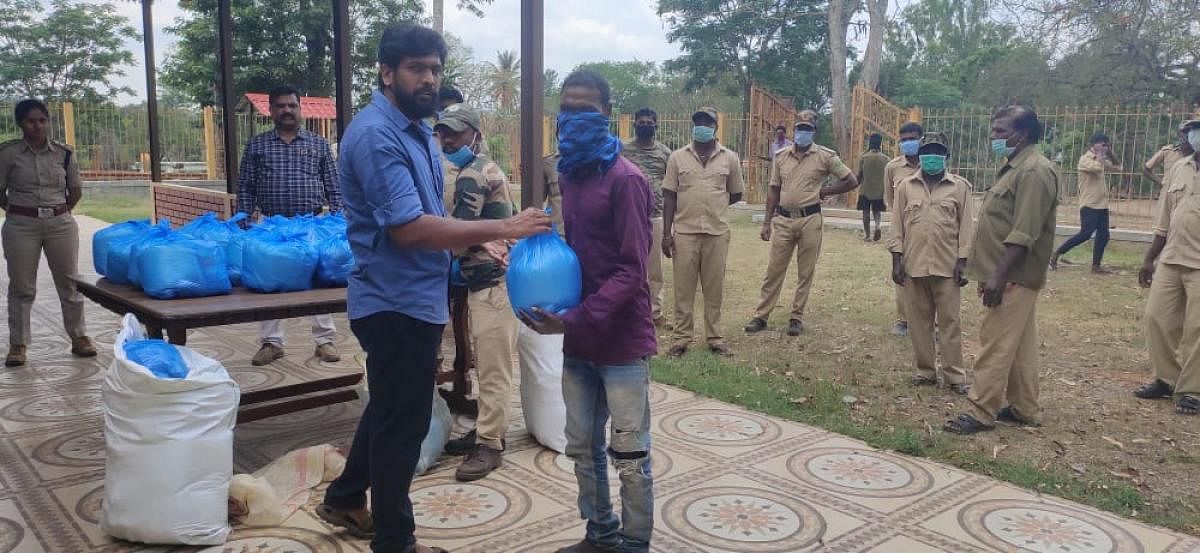 Groceries were provided to the mahouts and kavadis in Dubare elephant camp in Kushalnagar, on Thursday. DH Photo