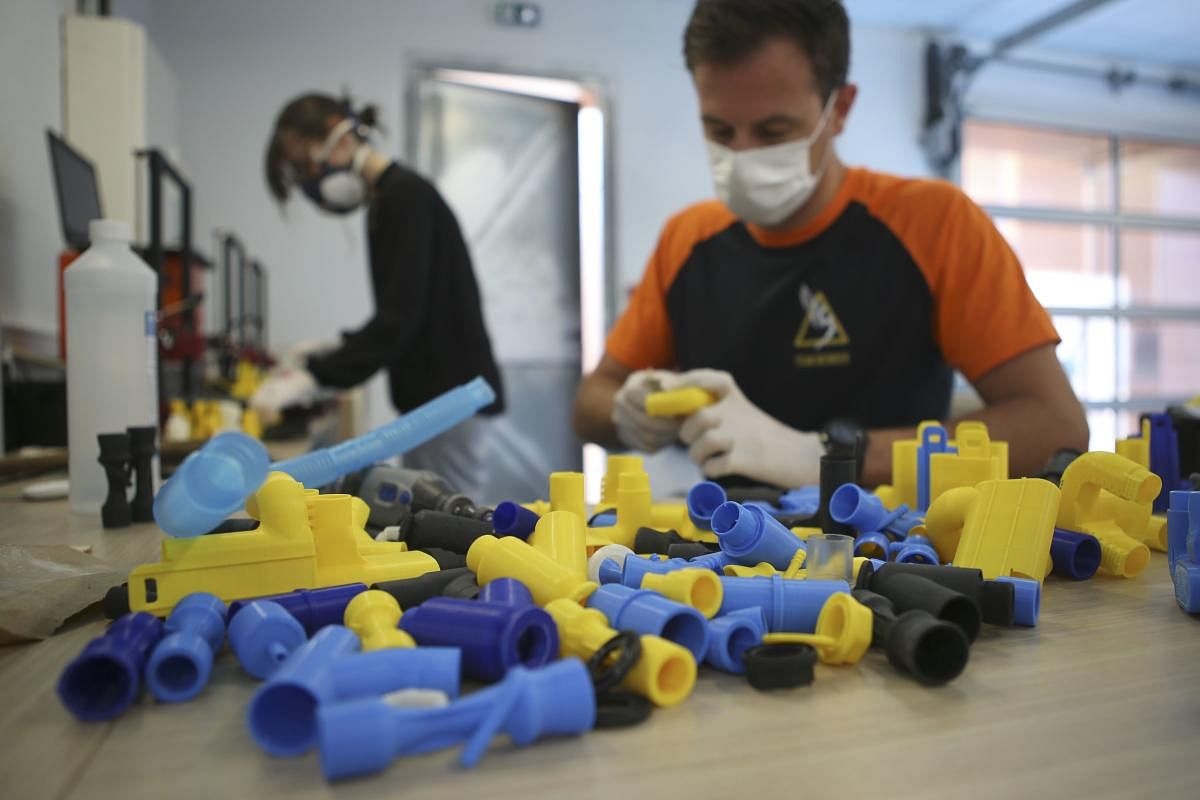 'Icare' founder Jeremy Neyrou works on pieces made from a 3D printer at a workshop (AFP Image)
