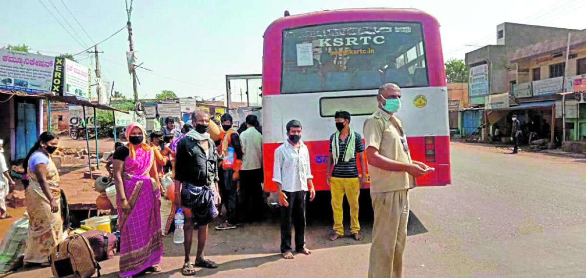 Labourers from Bagalkot, who had migrated to Dakshina Kannada district in search of work, return to their town in Kulageri Cross of Badami taluk by the special KSRTC bus arranged for them.