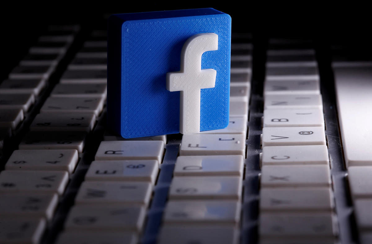 A 3D-printed Facebook logo is seen placed on a keyboard in this illustration taken March 25, 2020. REUTERS/Dado Ruvic/Illustration/File Photo GLOBAL BUSINESS WEEK AHEAD