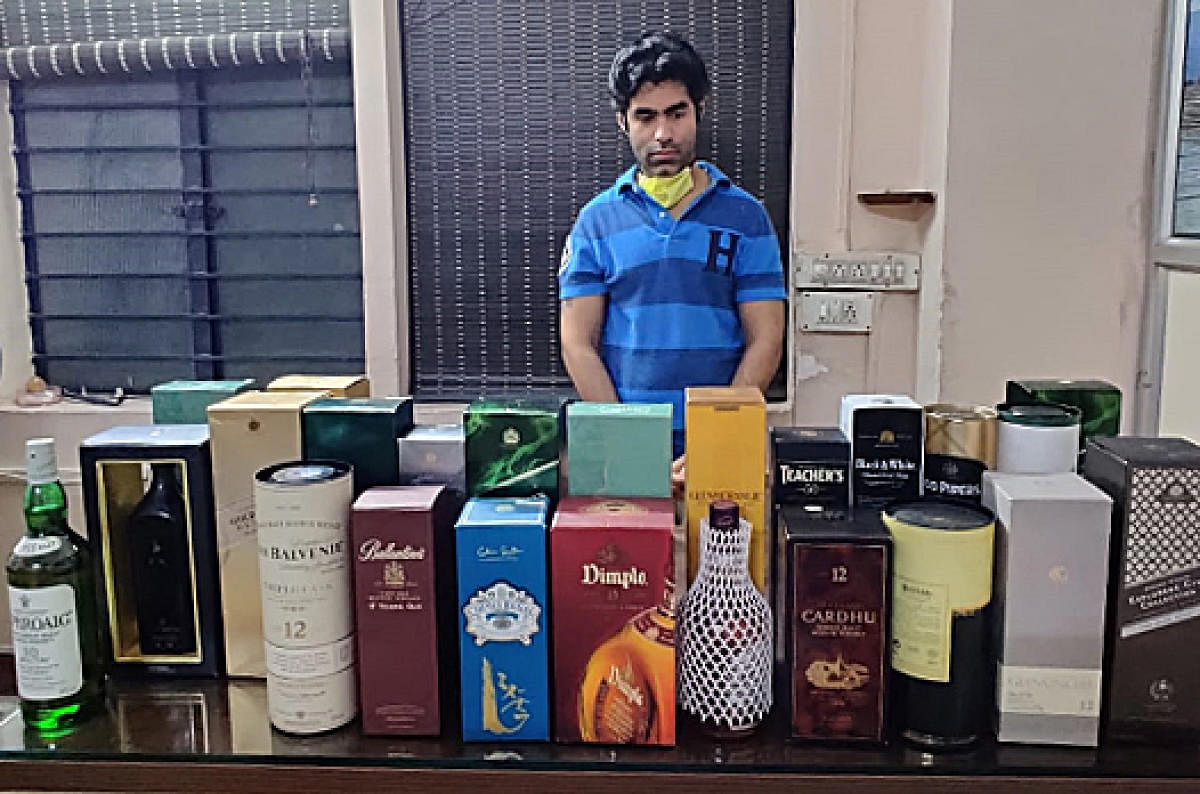 Roshan Bhateja with his duty-free liquor stock. Special arrangement