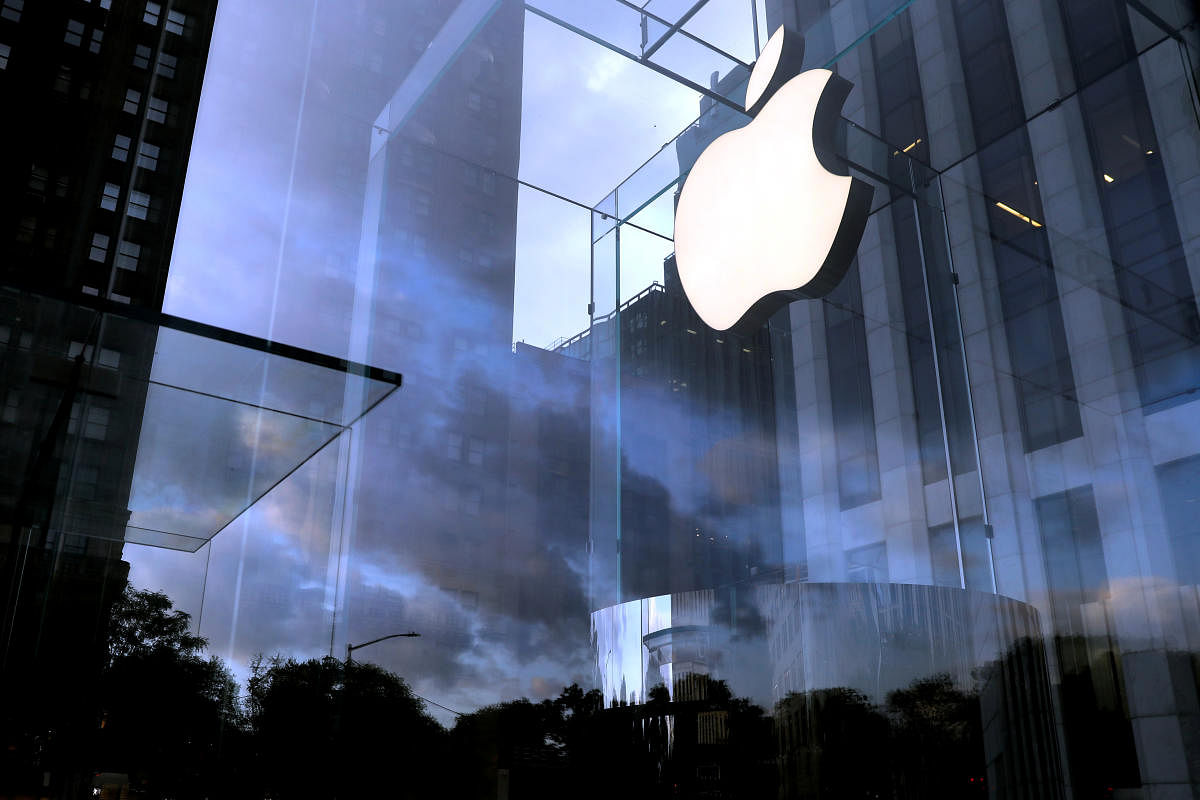 The Apple Inc. logo is seen hanging at the entrance to the Apple store on 5th Avenue in New York (Reuters Photo)
