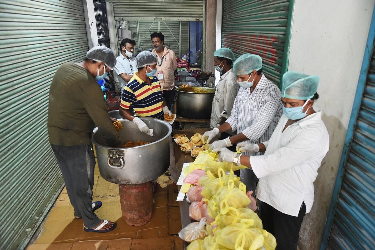 Lucknow: NGO workers packing food items to be distributed among needy people, during the nationwide lockdown imposed to stop the spread of the coronavirus, at Aminabad area in Lucknow, Wednesday, April 29, 2020. (PTI Photo/ Nand Kumar)(PTI29-04-2020_00009