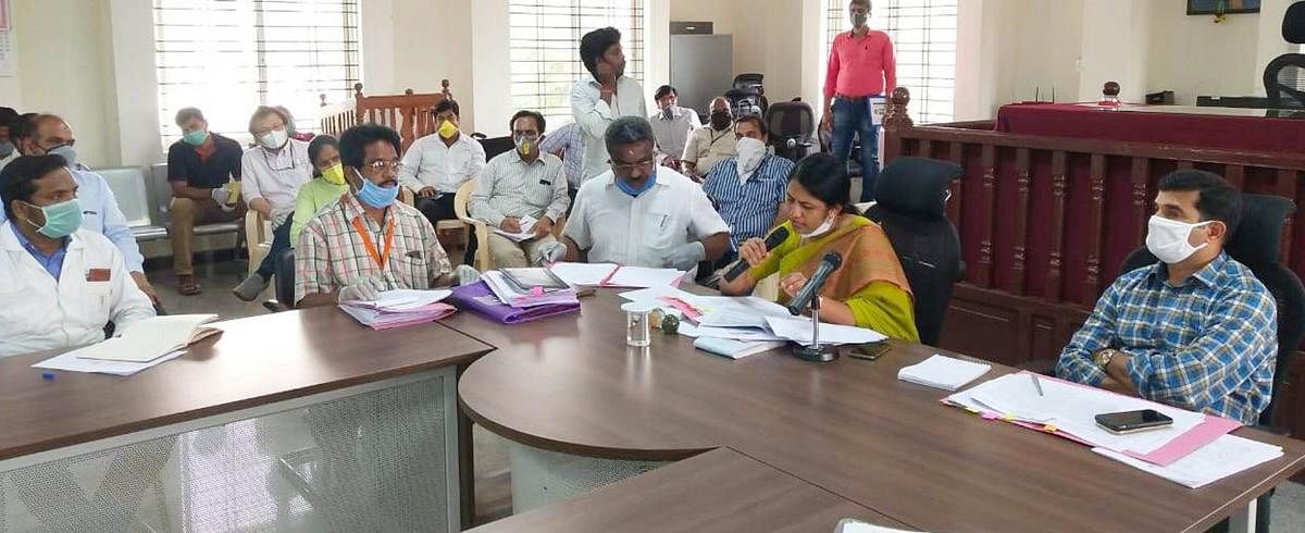 Deputy Commissioner C Satyabhama chairs a meeting with members and representatives of unions of industries in Kolar on Wednesday.