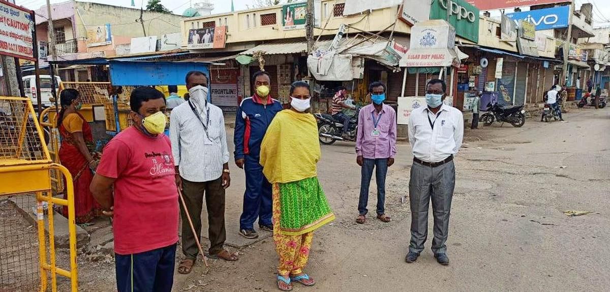 A team of nodal officers led by tahsildar Shobitha inspect situation at Ammavaripet in Kolar on Saturday.