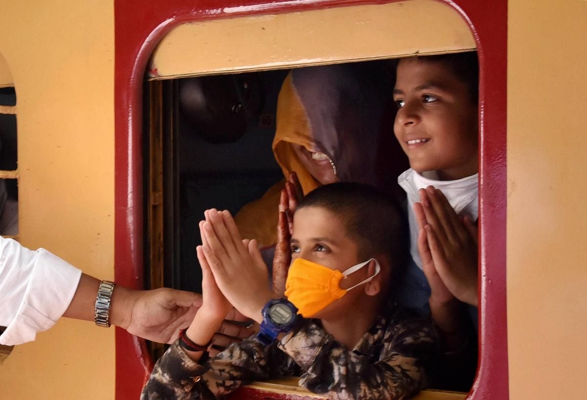 Hubballi: Stranded people board a train to their native places in Rajasthan, during the ongoing COVID-19 nationwide lockdown, in Hubballi, Wednesday, May 13, 2020. (PTI Photo)(PTI13-05-2020_000071B)