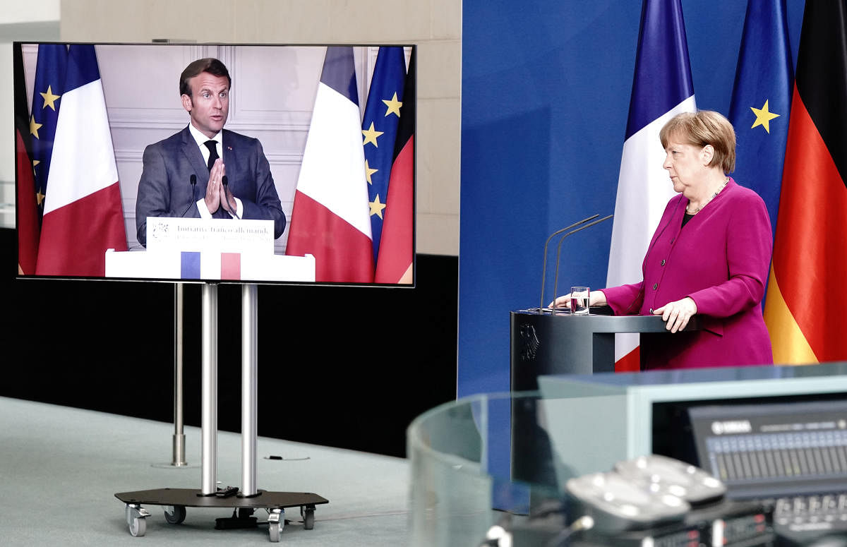 German Chancellor Angela Merkel holds a joint video news conference with French President Emmanuel Macron (Reuters Photo)