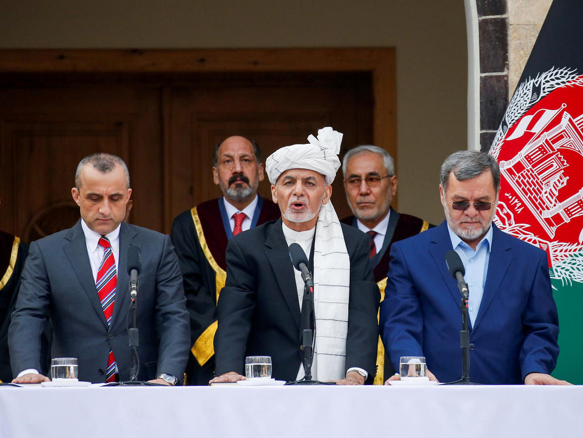 Afghanistan's President Ashraf Ghani, his first Vice President Amrullah Saleh (L) and second Vice President Sarwar Danish (R) taken an oath during their inauguration, in Kabul