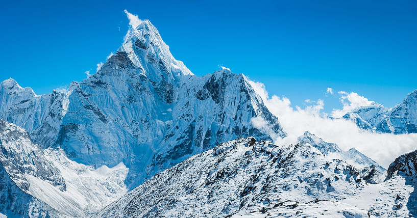 The snow capped spire and jagged rocky ridges of Ama Dablam (6812m) soaring over the idyllic Himalaya mountain wilderness of the Everest National Park, a UNESCO World Heritage Site. (iStock Photo)