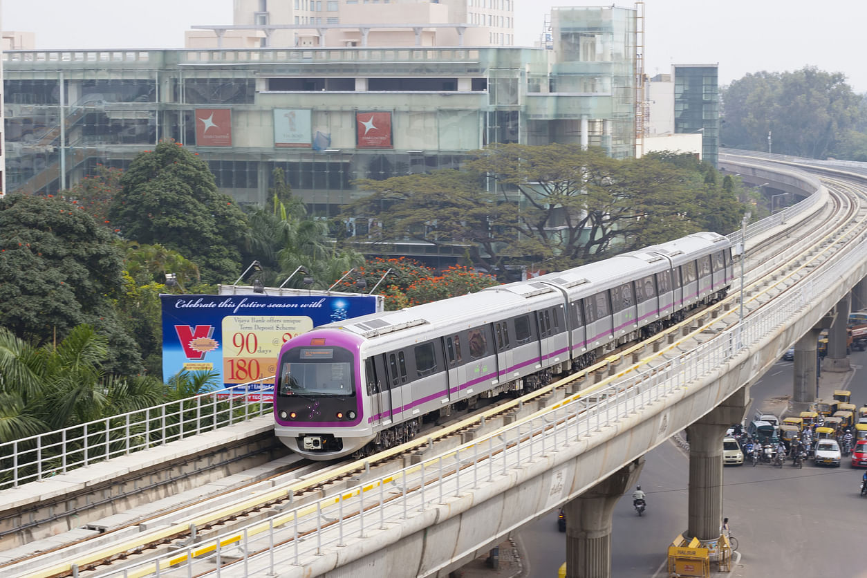  A train of the Bangalore Metro Rail, a rapid transit rail system, moves along an elevated track in downtown Bangalore. (Istock Photo)