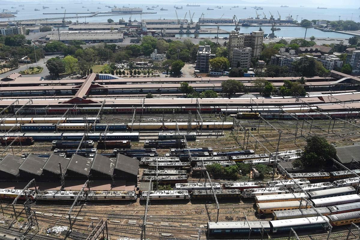 An aerial view shows parked trains at Chhatrapati Shivaji Maharaj railway terminus during a one-day Janata curfew imposed as a preventive measure against COVID-19. AFP