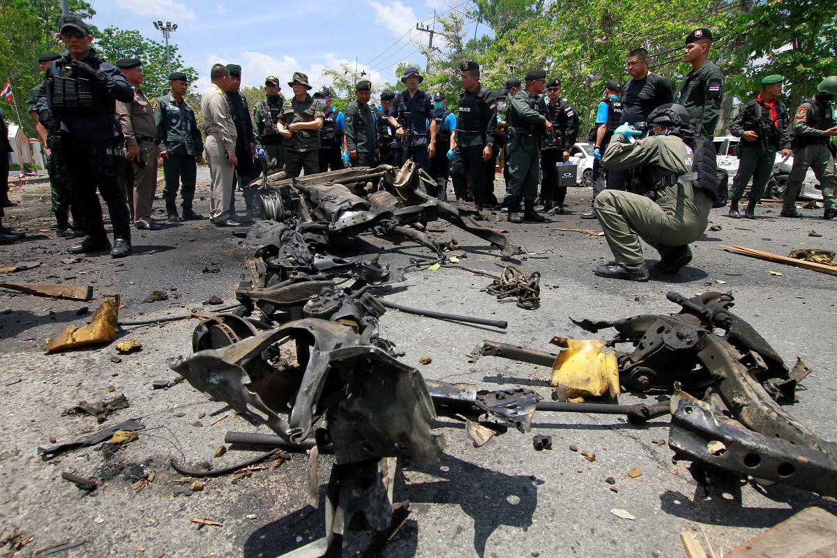 Security personnel inspect the site of a car bomb after if exploded in front of the government's Southern Border Provinces Administrative Centre in Yala. Credit: Reuters Photo