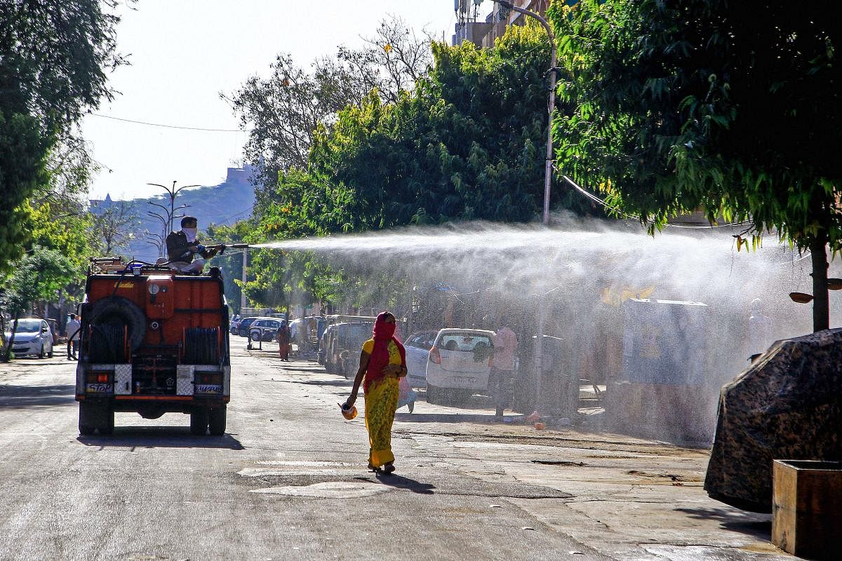 Fire brigade personnel sanitise the Ramganj Bazar during the nationwide lockdown imposed in the wake of the novel coronavirus pandemic, in Jaipur, Saturday, April 4, 2020.(PTI Photo)