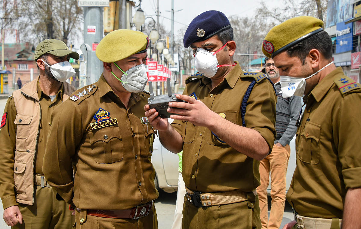 Police uses drone to keep a check in the interior areas, during restrictions imposed as a precautionary measure to contain the spread of coronavirus, in Srinagar, Monday, March 23, 2020. Credit: PTI Photo