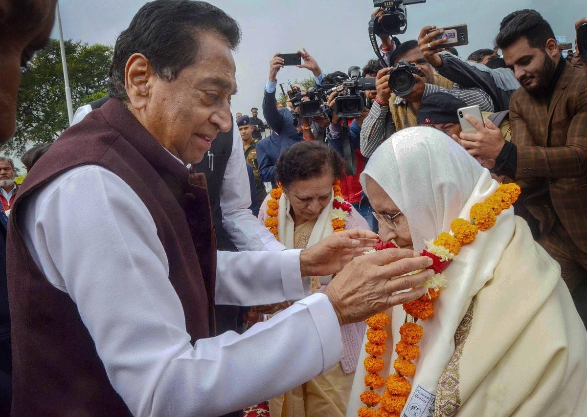 Madhya Pradesh Chief Minister Kamal Nath felicitate family members and widows of army personnel at a programme organised on the occasion of Vijay Diwas. PTI
