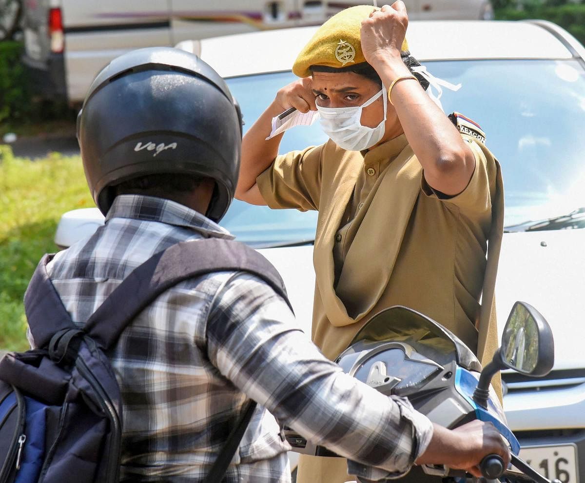A security personnel wearing masks is seen outside the Special Isolation Ward set up to provide treatment to novel coronavirus patients at Kochi Medical college, in Kerala. PTI file photo