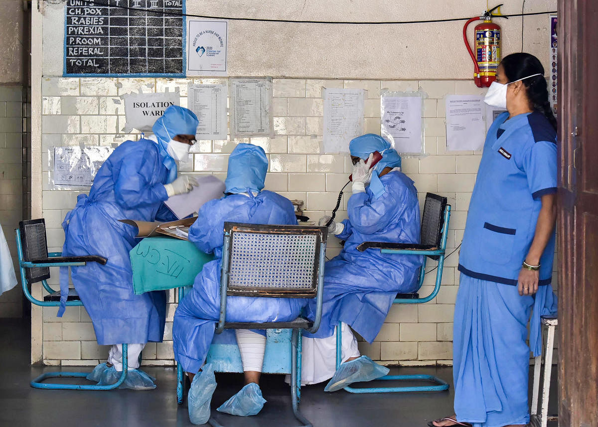  Medics outside an isolation ward of the novel coronavirus (COVID-19) at a hospital in Hyderabad. (PTI Photo)