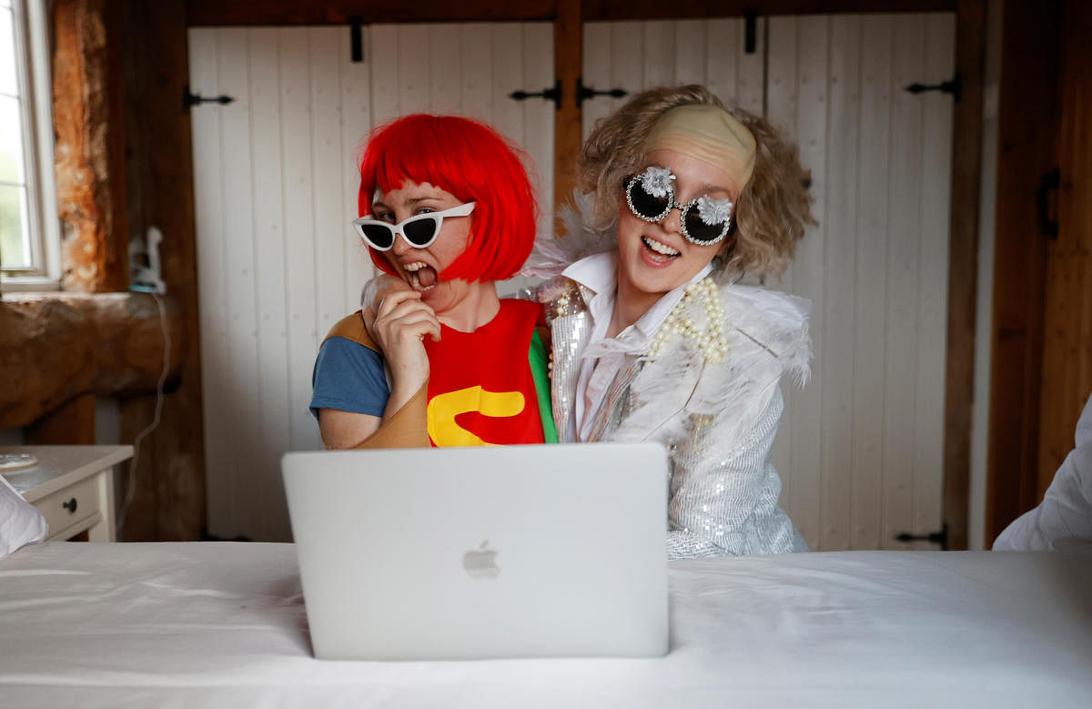 Emily dressed as Elton John and Molly as Lady Gaga watch the concert One World: Together At Home (Reuters Photo)