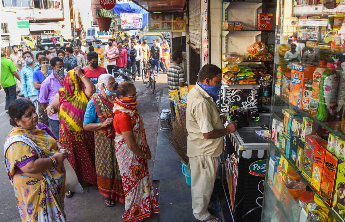  People stand in a queue outside a chemist shop while maintaining social distance, during the nationwide lockdown in the wake of coronavirus pandemic, at Khetwadi, in Mumbai, Wednesday, March 25, 2020. (PTI Photo)