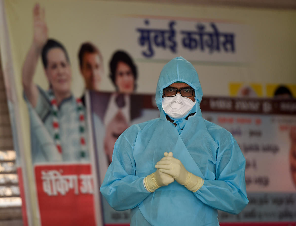 A doctor prepares to conducts swab tests of journalists as a preventive measure against COVID 19 during the nationwide lockdown to curb the spread of coronavirus, at CSMT in Mumbai, Thursday, April 16, 2020. (PTI Photo)