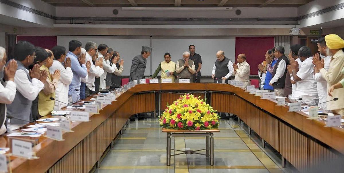 rime Minister Narendra Modi being greeted by various party leaders on his arrival for an all-party meeting ahead of the winter session of Parliament. PTI