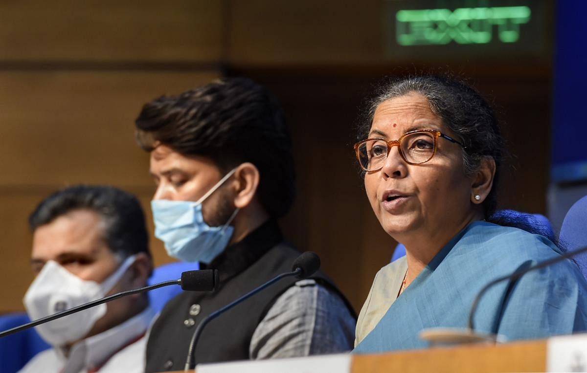 Union Finance Minister Nirmala Shitharaman addresses a press conference, in New Delhi, Sunday, May 17, 2020. MoS for Finance Anurag Thakur (C) is also seen. Credit: PTI Photo