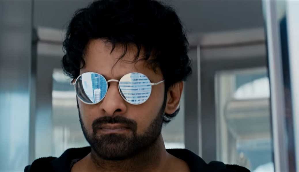 Prabhas, after investing four years for the Baahubali films, appears like someone exhausted after a gruelling session of heavy lifting in the gym.