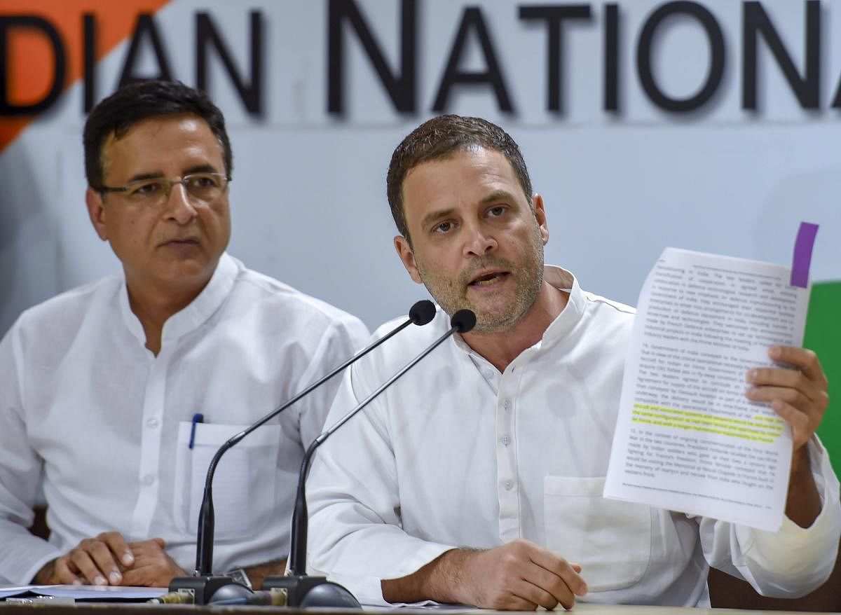 Congress President Rahul Gandhi addresses a press conference in New Delhi on Thursday, August 30, 2018. The party spokesperson Randeep Singh Surjewala is also seen. PTI