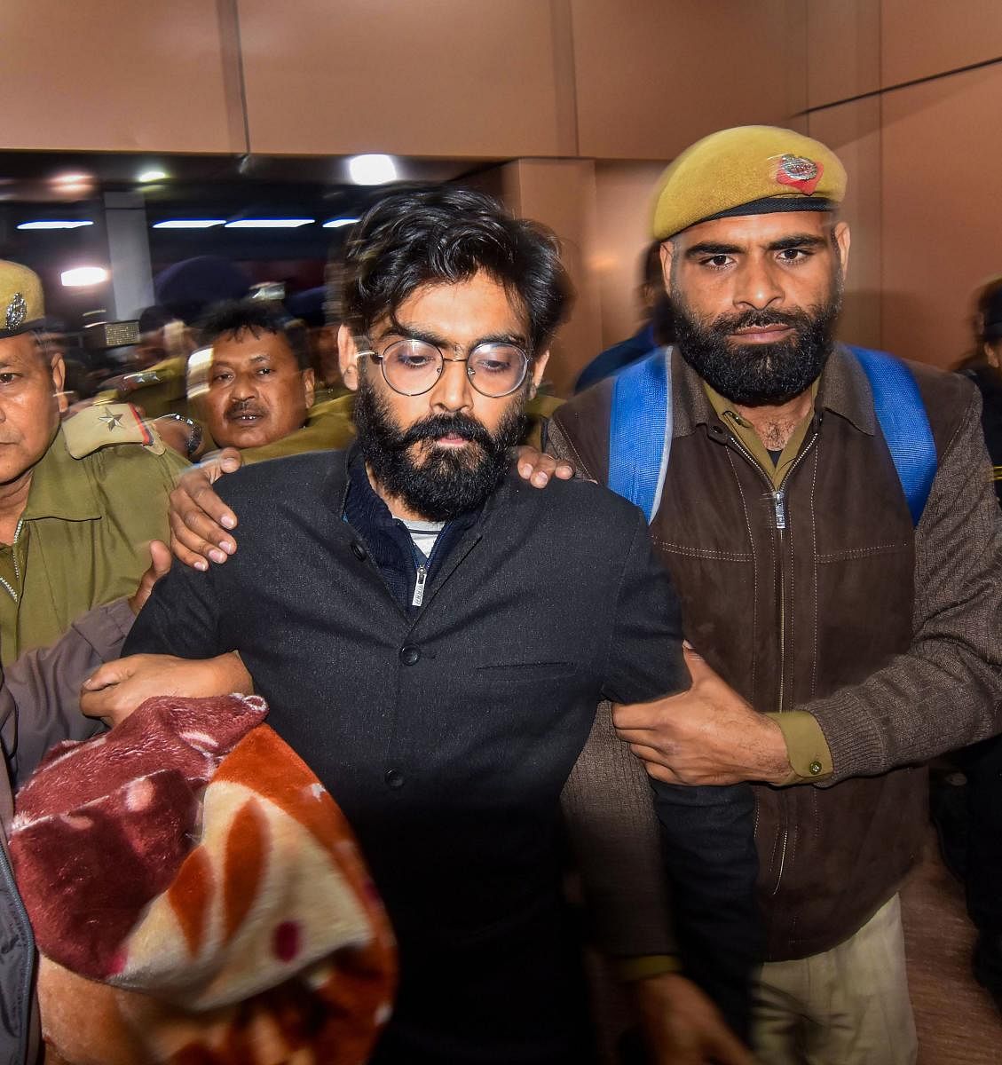 Sharjeel Imam, former student of JNU, being brought by Assam Crime Branch and Delhi police from Tihar Jail for his alleged controversial remark on North East States, at Guwahati Railway station. PTI