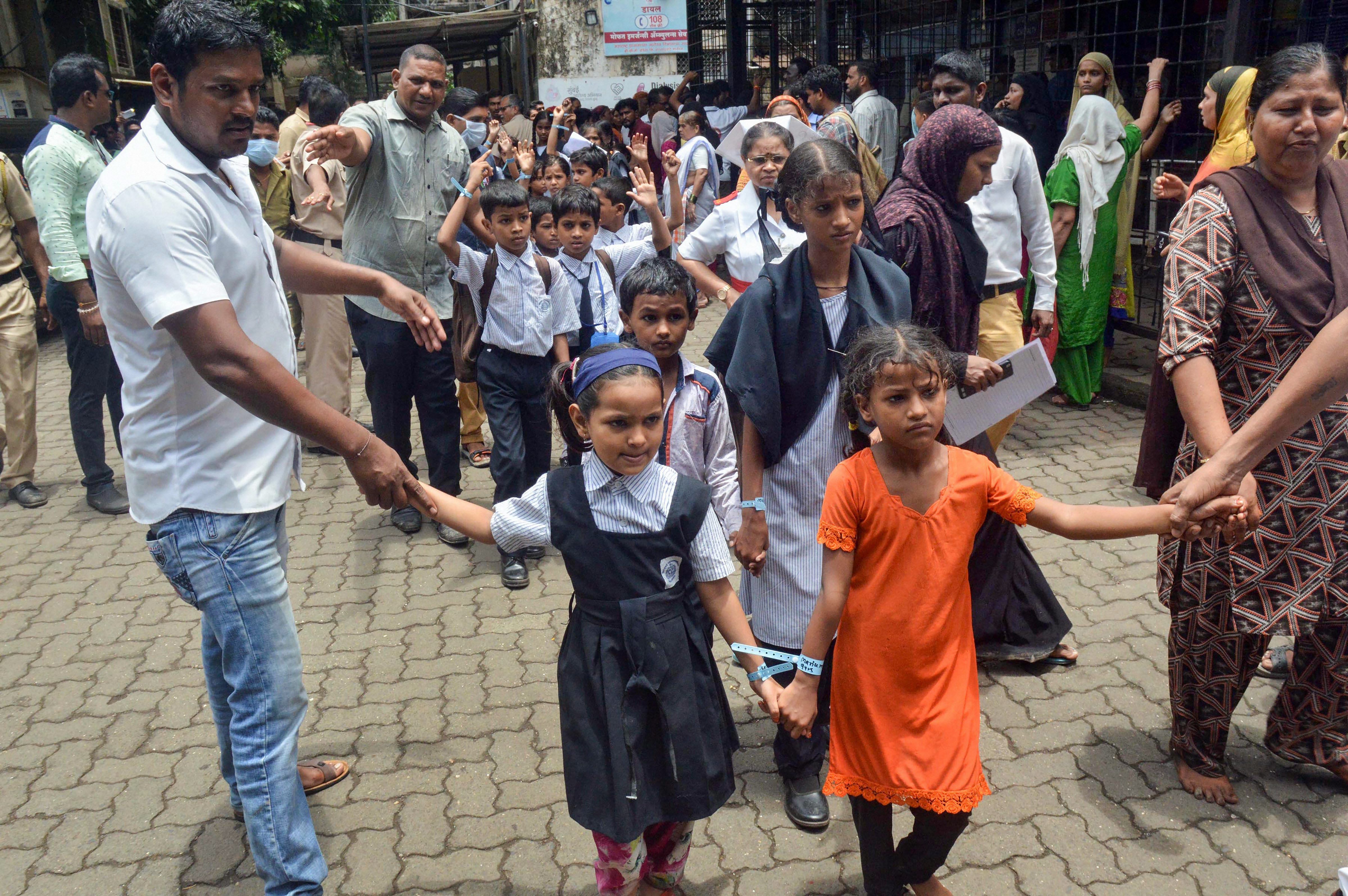 Students of BMC school in Govandi who fell sick due to the suspected poisoning after they took iron-boosting medicines given by the school, at a hospital in Mumbai on Friday. PTI