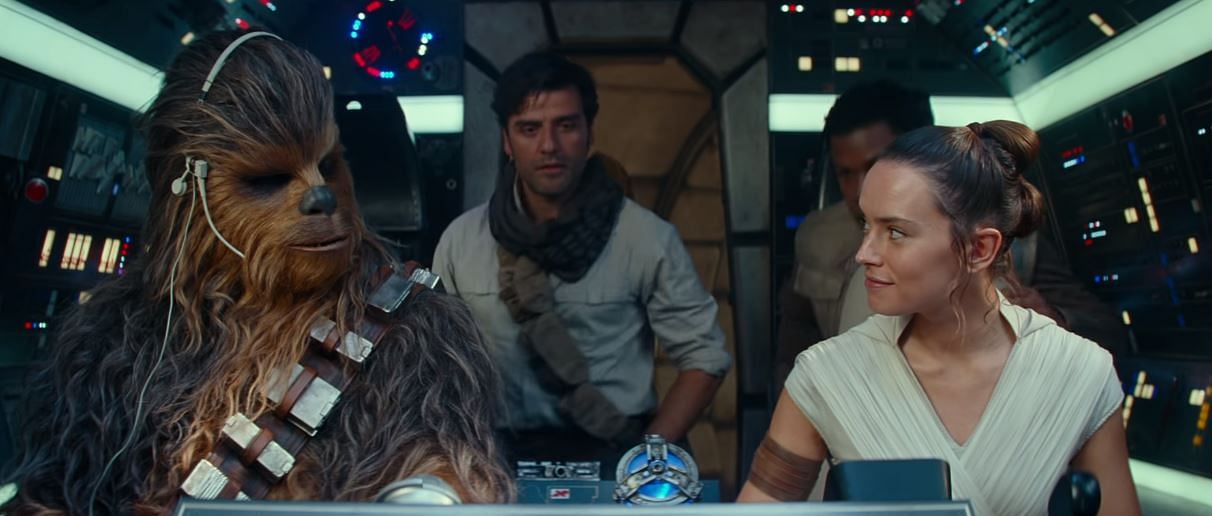 Chewie, Rey, Poe, Finn and Threepio (not seen) on the Millennium Falcon in The Rise of Skywalker.