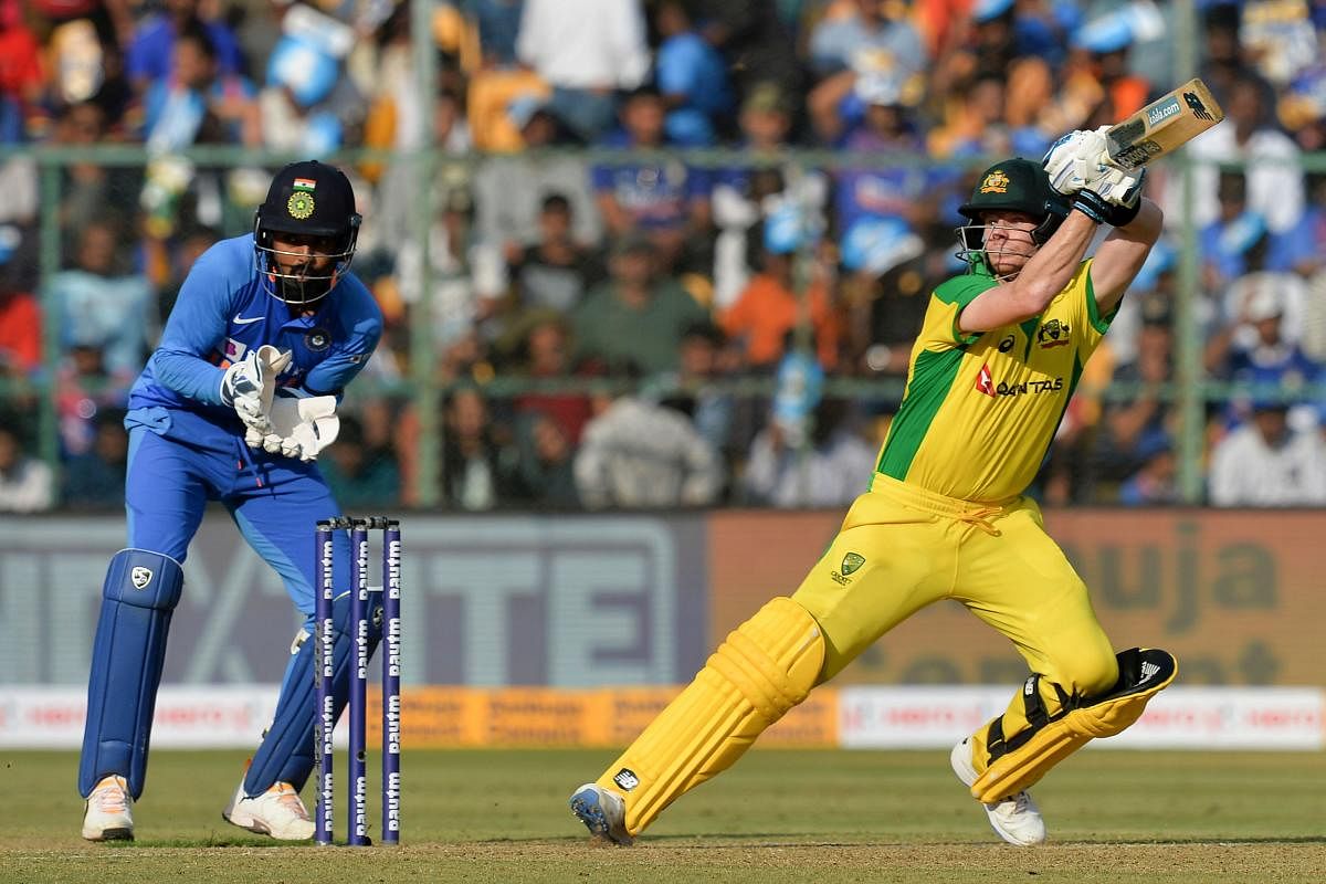 Australia's Steve Smith plays a shot during the third and last one day international (ODI) cricket match of a three-match series between India and Australia at the M. Chinnaswamy Stadium. AFP