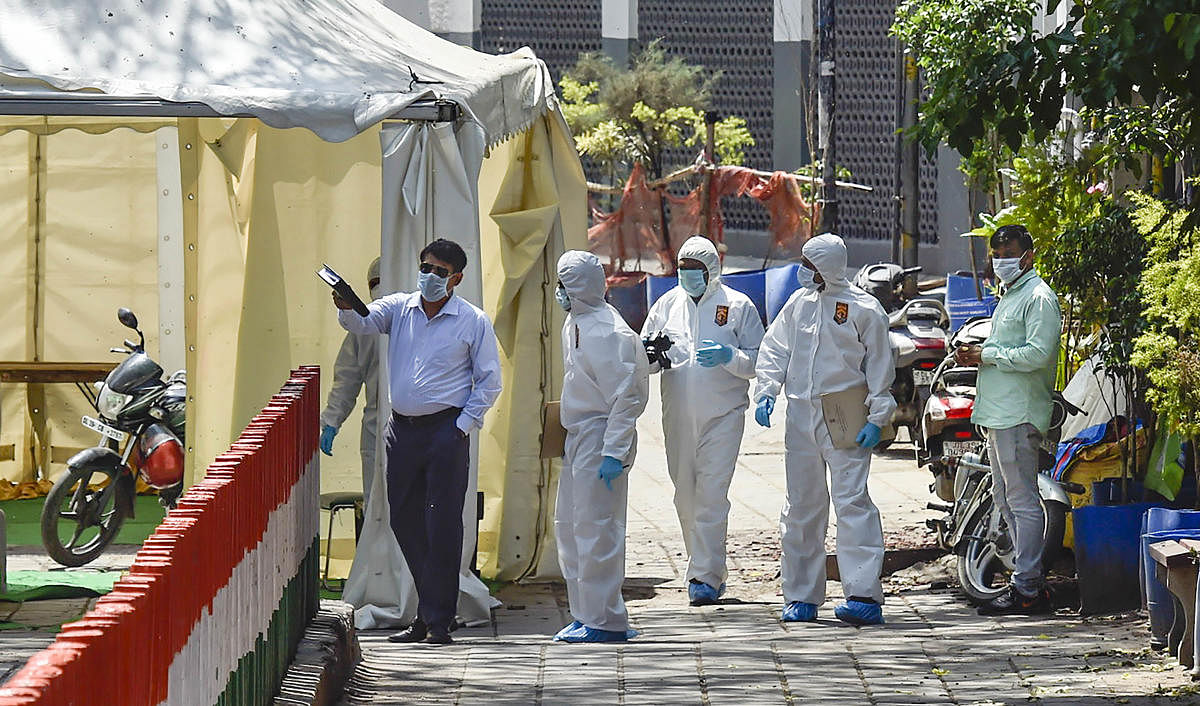  Forensics and crime branch officials arrive at Nizamuddin Markaz to conduct investigation, during the nationwide lockdown to curb the spread of coronavirus, in New Delhi, Sunday, April 5, 2020. Credit: PTI Photo