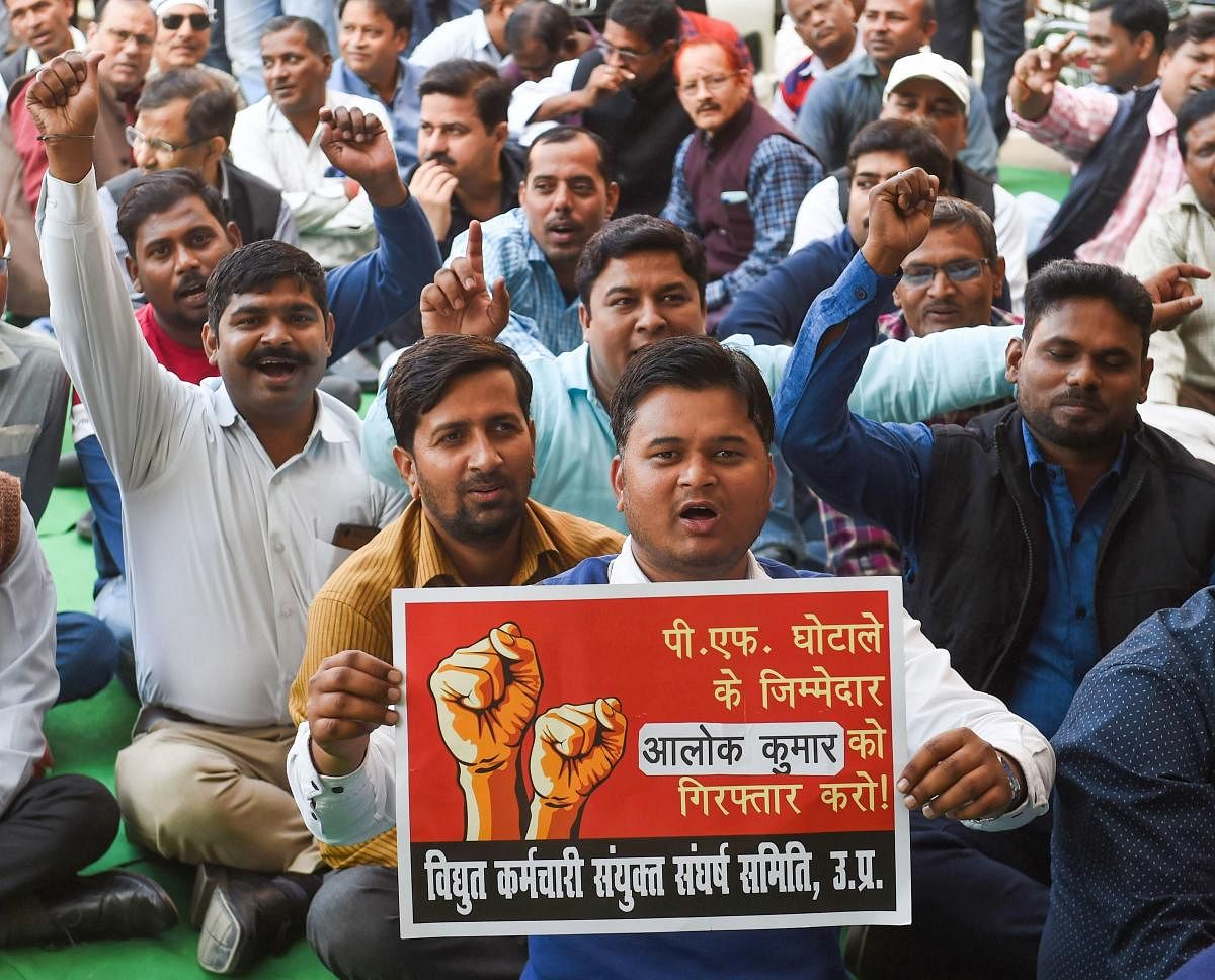Uttar Pradesh Power Corporation Limited (UPPCL) employees raise slogans as they began their 48-hour work boycott, in Lucknow, Monday. (PTI Photo)