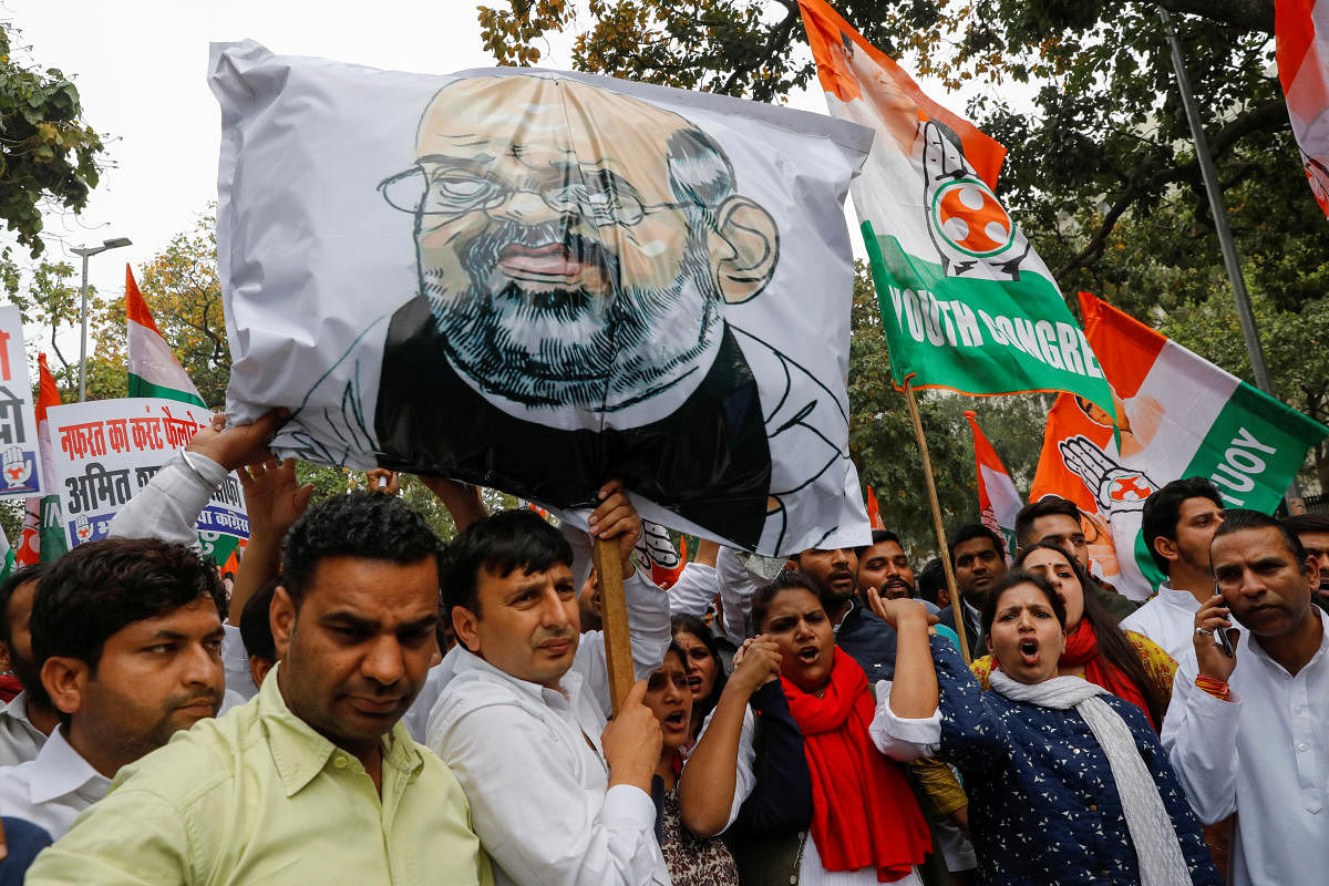 Activists of the youth wing of India's main opposition Congress party show slogans during a protest demanding the resignation of Home Minister Amit Shah, in New Delhi. Credit: Reuters Photo
