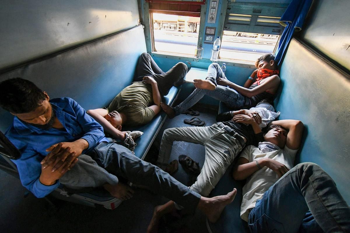 Bhopal: Migrants board a train from Habibganj to Arariya (Bihar) during the ongoing nationwide COVID 19 lockdown, in Bhopal, Tuesday, May 19, 2020. (PTI Photo)(PTI19-05-2020_000232A)