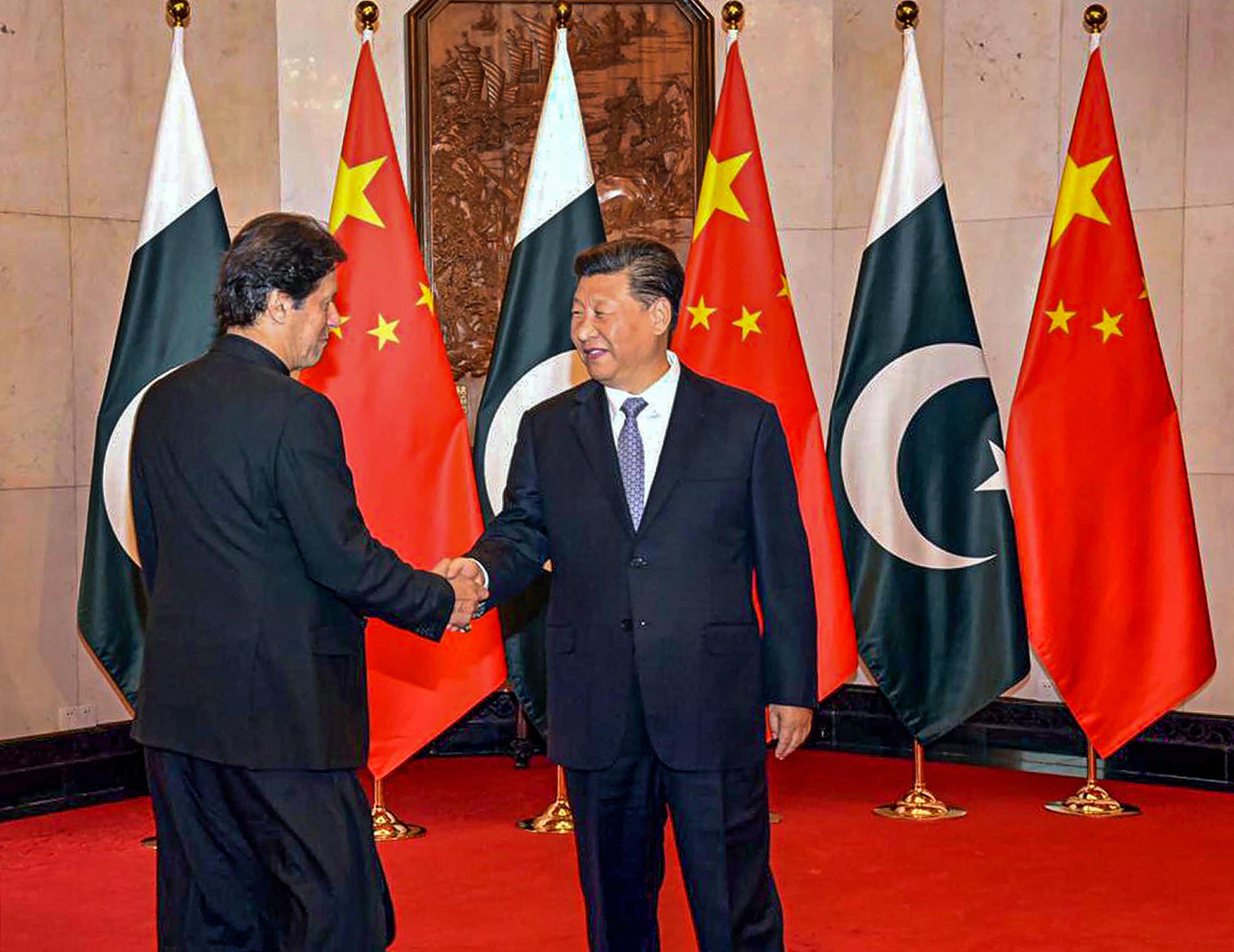 Chinese President Xi Jinping shakes hands with Pakistani Prime Minister Imran Khan. (PTI Photo)