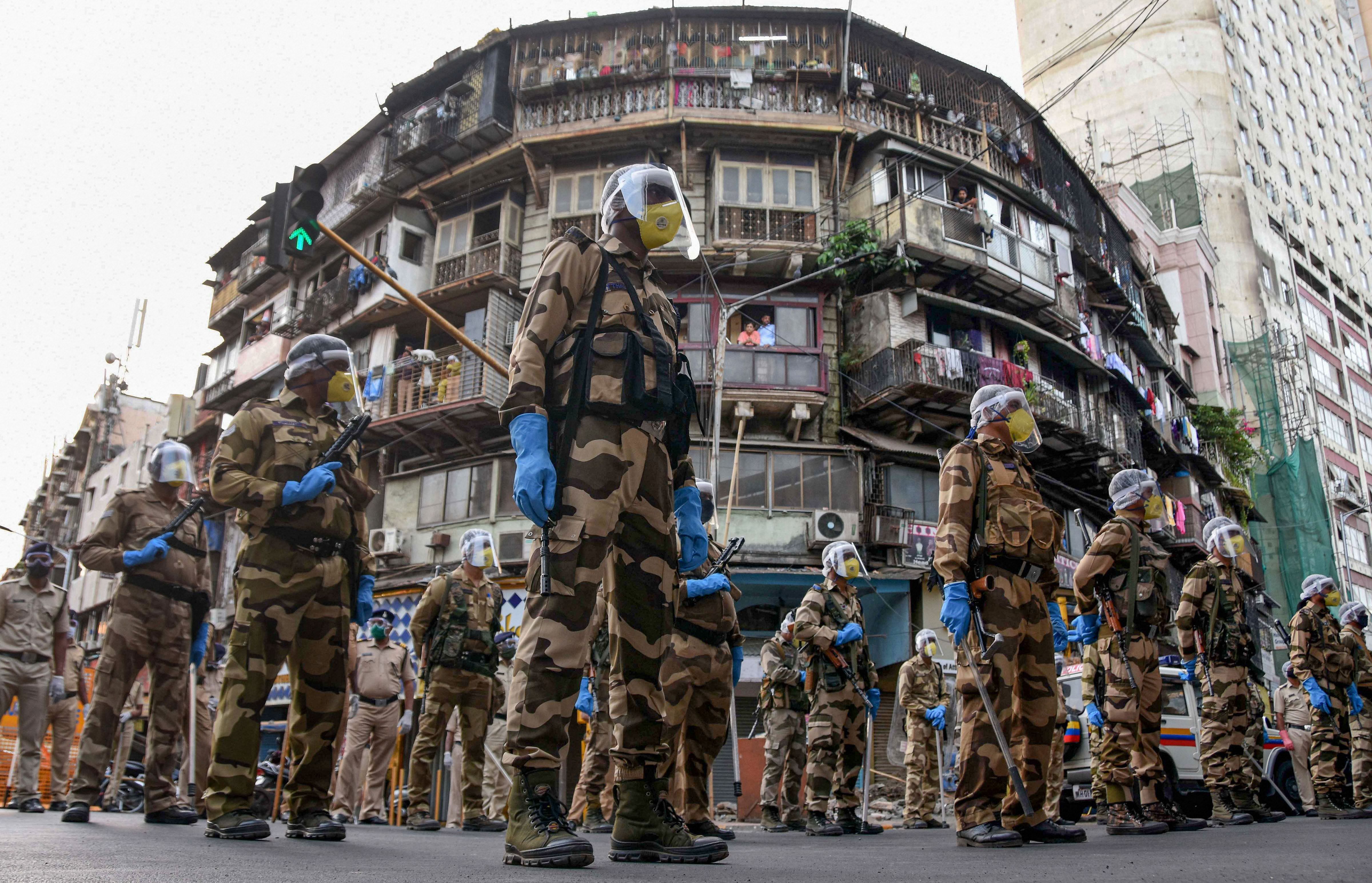 Central Industrial Security Force (CISF) personnel conduct a flag march at Bhendi Bazaar, during the ongoing nationwide COVID-19 lockdown, in Mumbai, Wednesday, May 20, 2020. (PTI Photo)