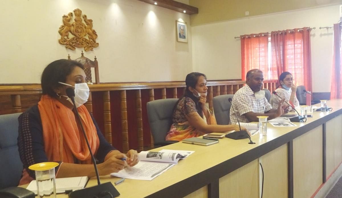 In-charge Secretary V Anbu Kumar chairs a meeting at DC's office in Madikeri on Thursday. DH Photo