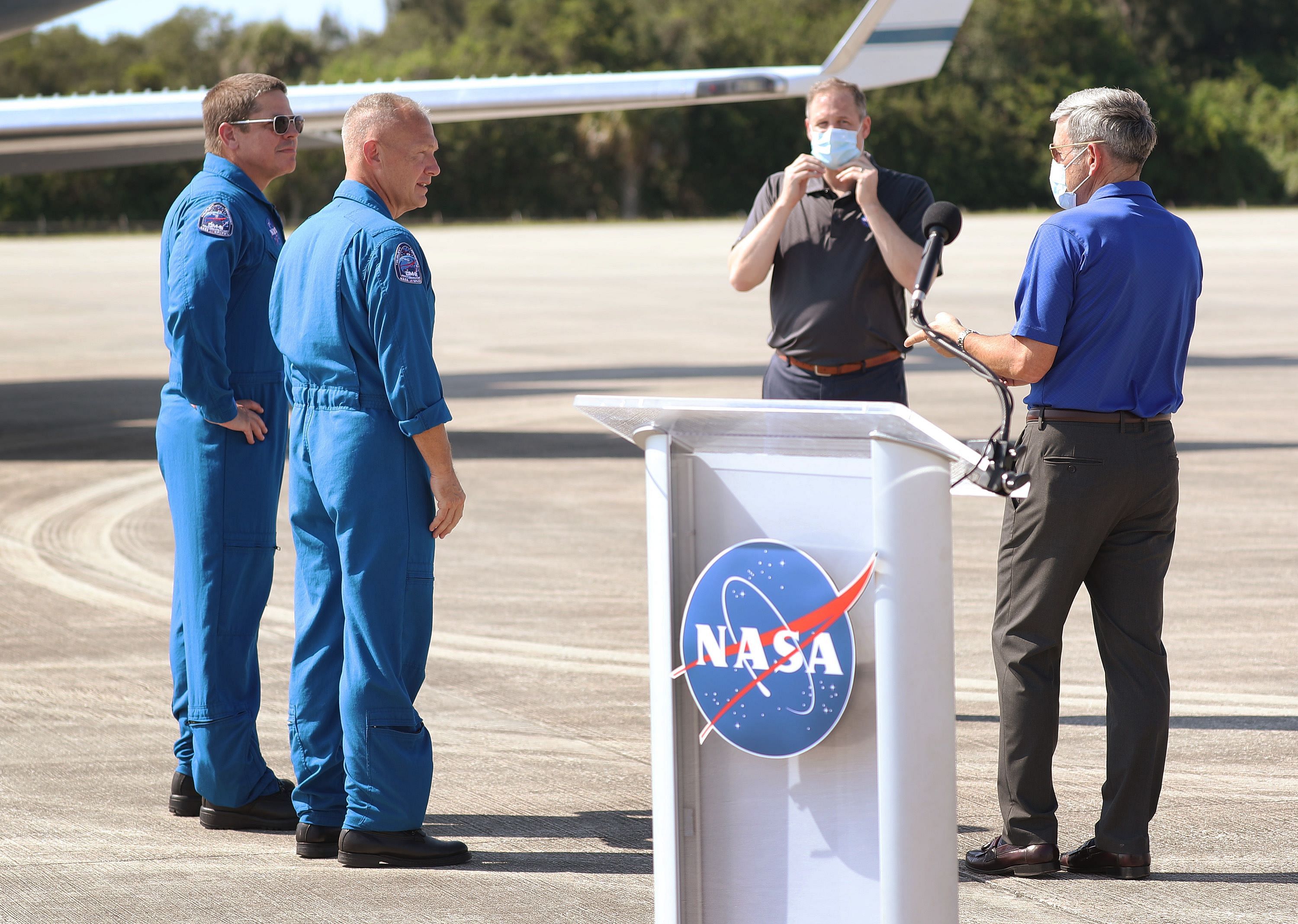 NASA astronauts Bob Behnken (left) and Doug Hurley (2nd left) speak with NASA Administrator Jim Bridenstine (C) and Robert Cabana (right), the director of NASA's John F. Kennedy Space Center, after arriving at the Kennedy Space Center on May 20, 2020 in Cape Canaveral, Florida. The astronauts arrived for the May 27th scheduled inaugural flight of SpaceXs Crew Dragon spacecraft. They will be the first people since the end of the Space Shuttle program in 2011 to be launched into space from the United States. (Joe Raedle/Getty Images/AFP)