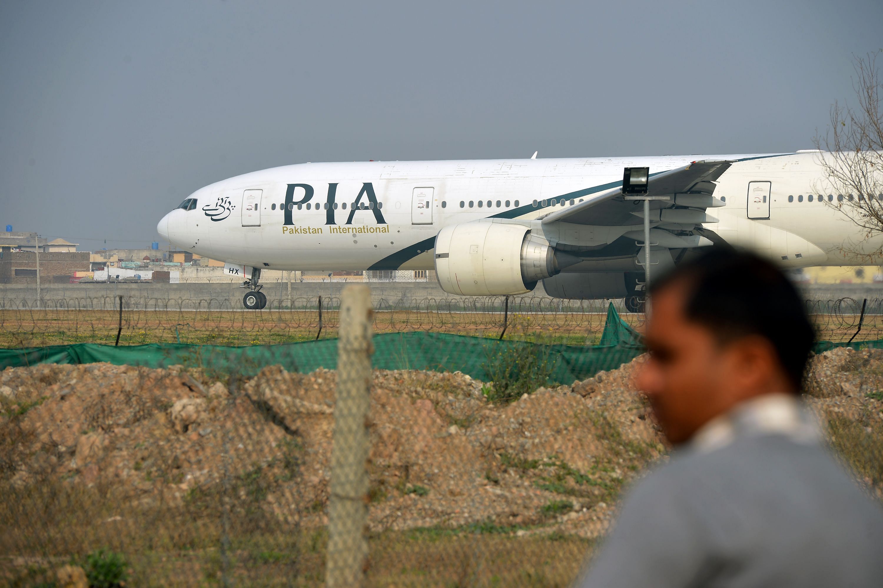 The pilot replied, "We are returning back, sir, we have lost engines," and the controller cleared the plane to land on either of Karachi airport's two West-Southwest-facing runways. (Credit: AFP Photo)