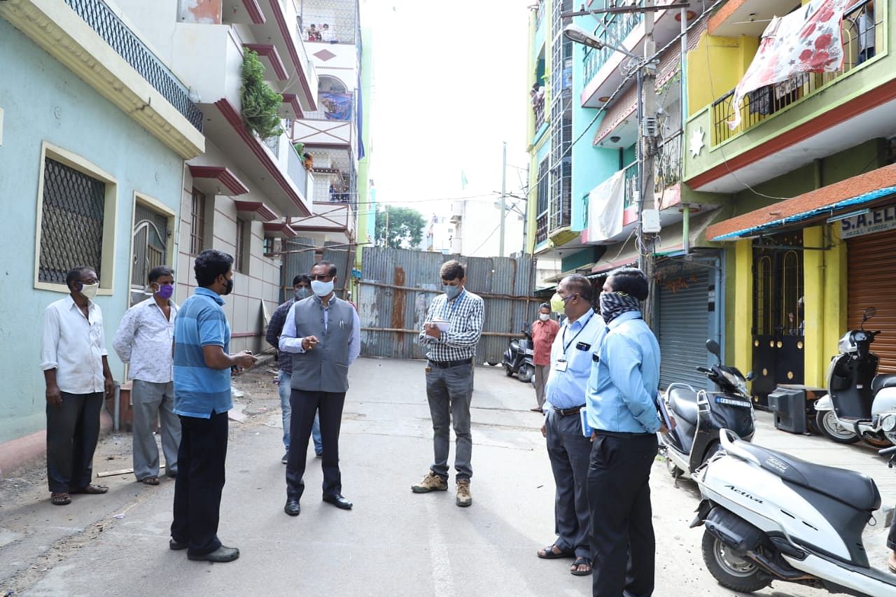 Reviewing the situation in containment areas that have been sealed down. (DH Photo)