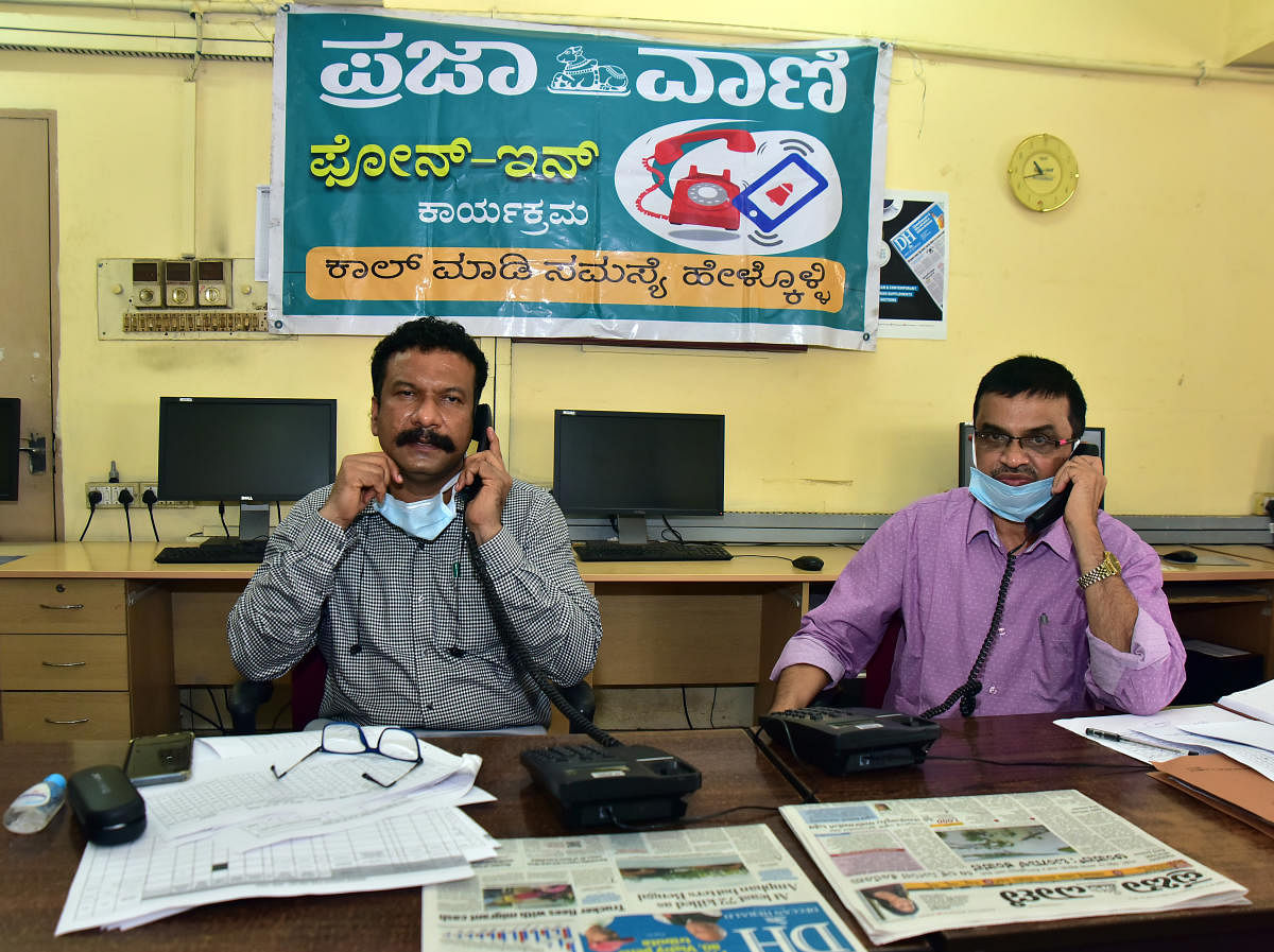  (From left) District Vector-borne Disease Control Officer Dr Naveen Chandra Kulal and District Health Officer Dr Ramachandra Bayari speak during the Prajavani phone-in programme, organised at PV-DH office, in Mangaluru on Friday. DH Photo
