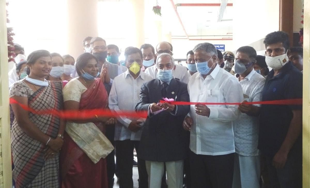 District In-charge Minister V Somanna and senior physician Dr Patkar inaugurate the Covid-19 testing laboratory at Kodagu Institute of Medical Sciences on Friday.