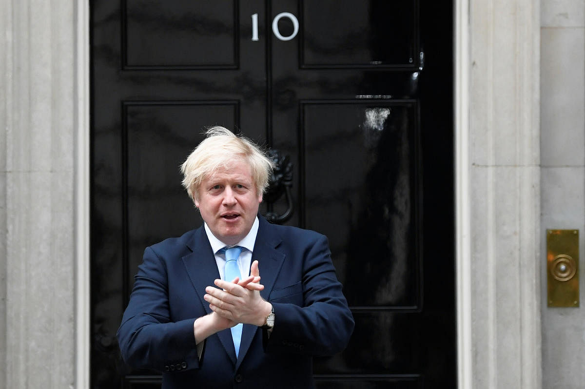 Britain's Prime Minister Boris Johnson applauds outside 10 Downing Street during the Clap for our Carers campaign in support of the NHS, following the outbreak of the coronavirus disease (COVID-19), in London, Britain, May 21, 2020. Credit: Reuters Image