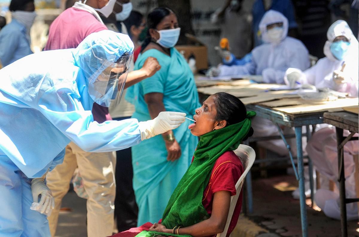 Medics conduct COVID-19 screening of residents at a camp, during the ongoing nationwide lockdown to curb the spread of coronavirus, at Dharavi in Mumbai, Friday, May 22, 2020. (PTI Photo)